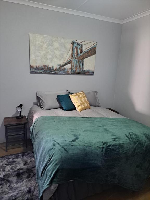 a bed with two pillows on it in a bedroom at 22 Duvenhage in Postmasburg