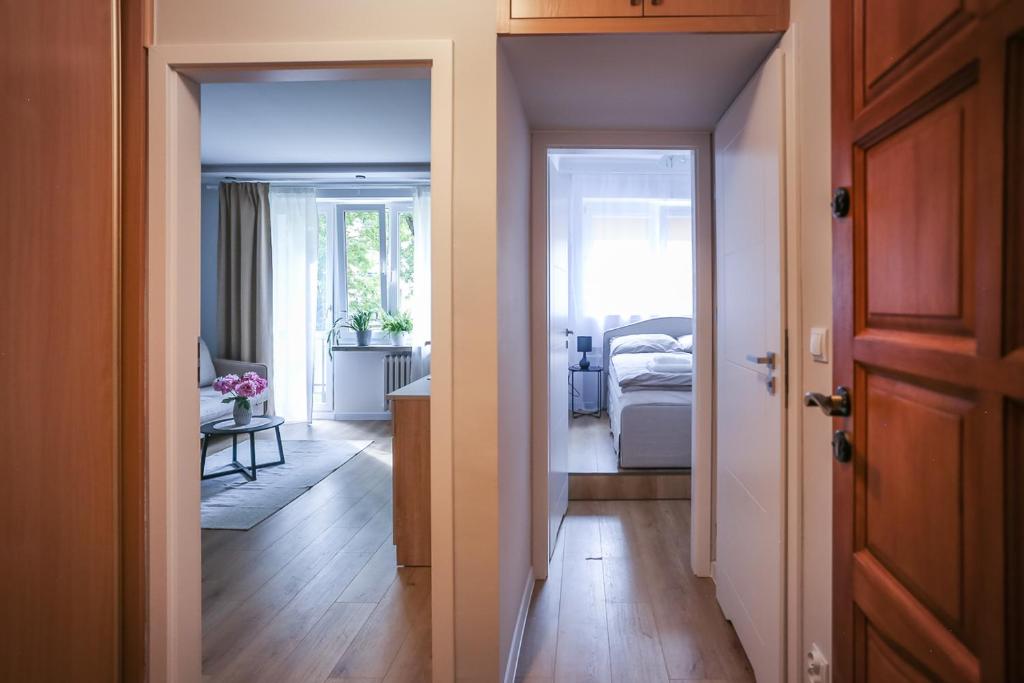 Postel nebo postele na pokoji v ubytování Zamojski nocleg