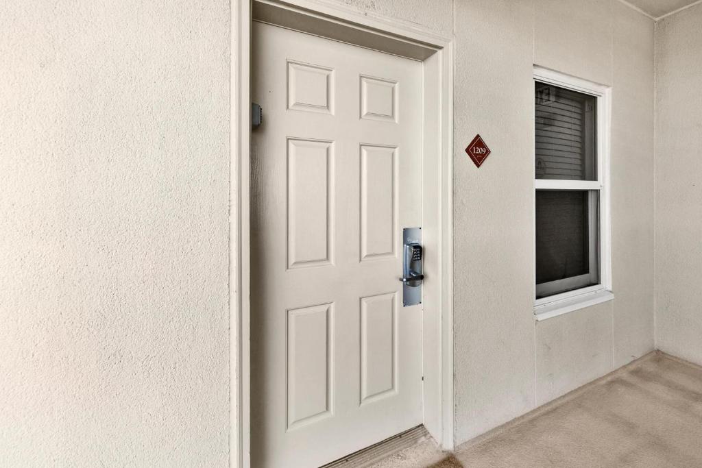 a white door in a room with a window at Ariel Dunes I Unit 1209 Gulf view in Destin