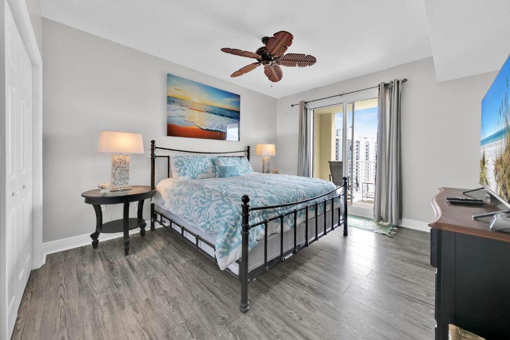 a bedroom with a bed and a ceiling fan at Ariel Dunes I Unit 1209 Gulf view in Destin