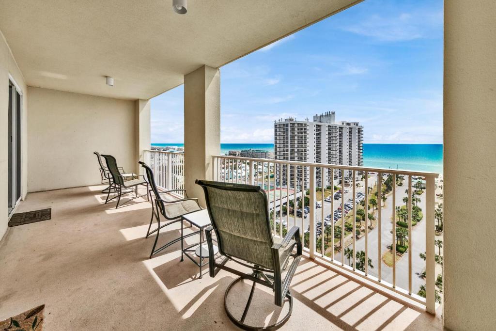a balcony with chairs and a view of the ocean at Ariel Dunes I Unit 1209 Gulf view in Destin