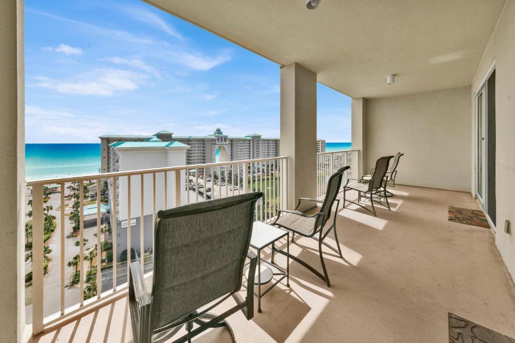 a balcony with chairs and a view of the beach at Ariel Dunes I Unit 1209 Gulf view in Destin