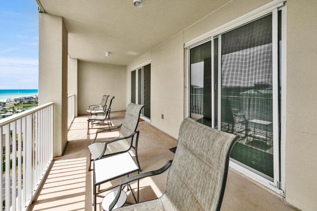 a balcony with chairs and a view of the ocean at Ariel Dunes I Unit 1209 Gulf view in Destin