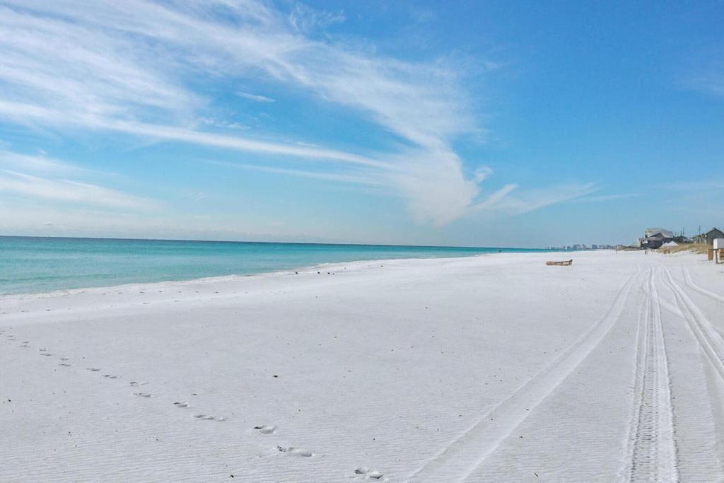 a beach with footprints in the sand and the ocean at Ariel Dunes I Unit 1209 Gulf view in Destin