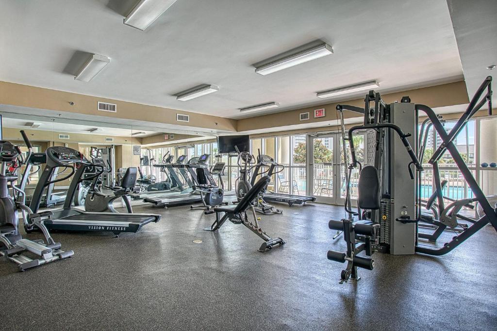 a gym with several treadmills and cardio machines at Ariel Dunes I Unit 1209 Gulf view in Destin