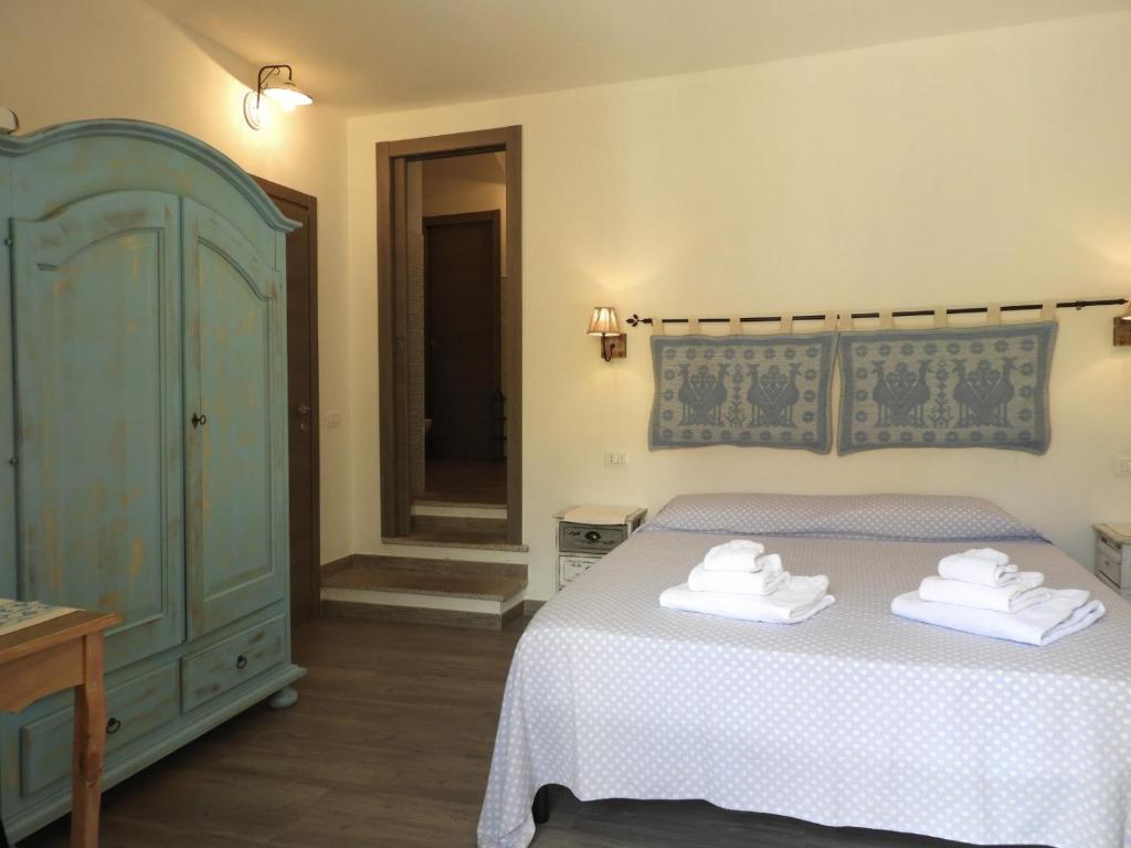 Postel nebo postele na pokoji v ubytování S'apposenteddu Affittacamere del Ristorante da Stefano