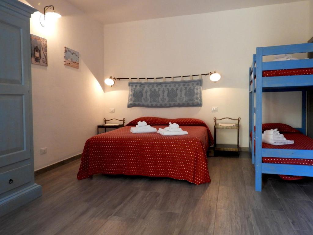 Postel nebo postele na pokoji v ubytování S'apposenteddu Affittacamere del Ristorante da Stefano