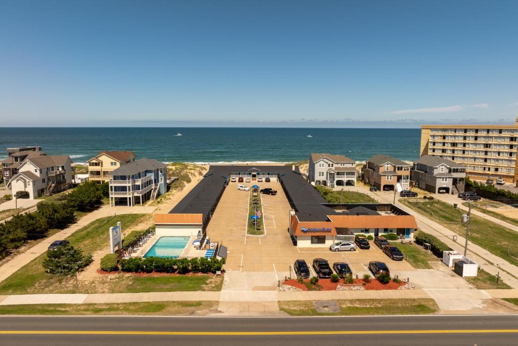 an aerial view of a resort with the ocean at Dolphin Oceanfront Motel - Nags Head in Nags Head