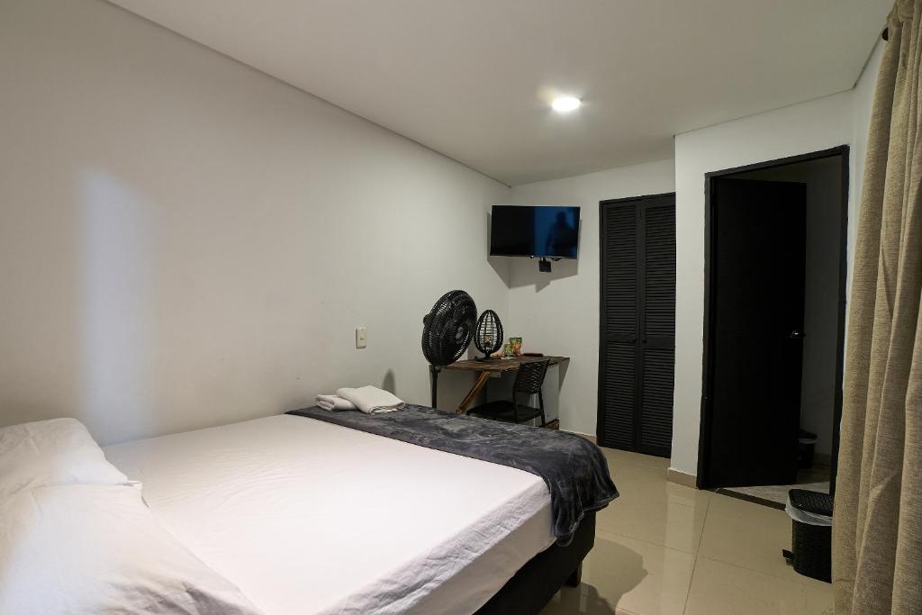 Postel nebo postele na pokoji v ubytování Hotel Express Medellin FARUM