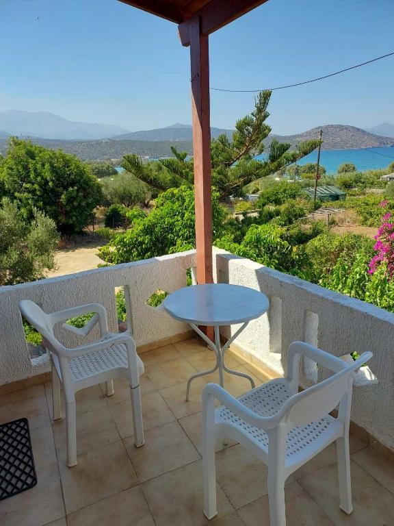 a table and chairs on a patio with a view of the ocean at Victoria2 in Istro
