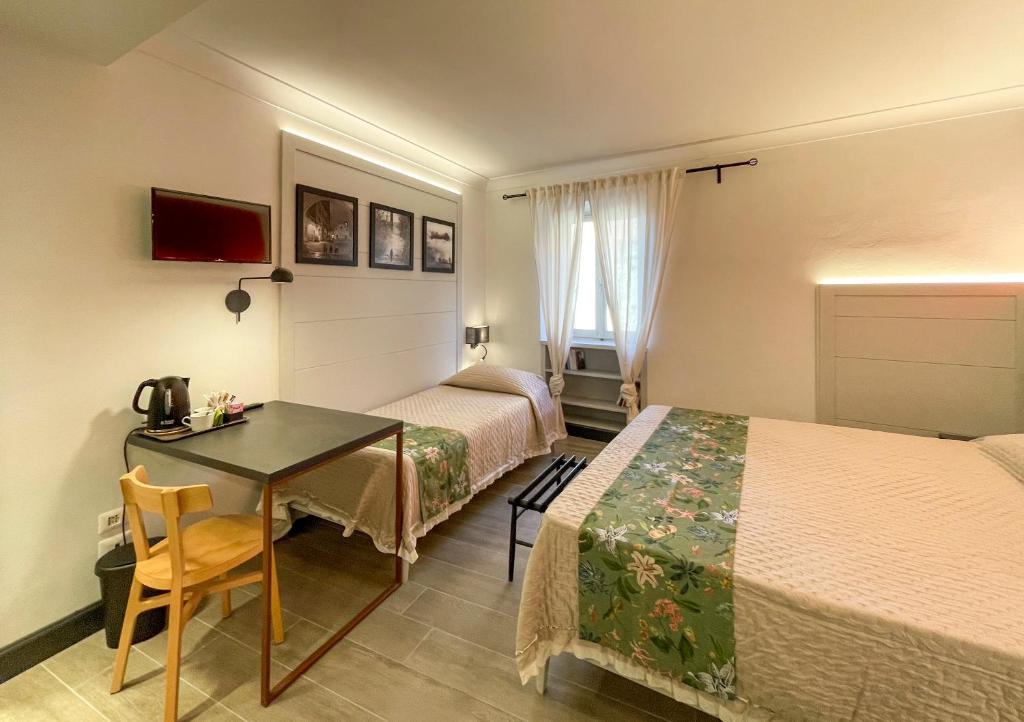 Postel nebo postele na pokoji v ubytování Duccio Nacci Rooms- Guesthouse