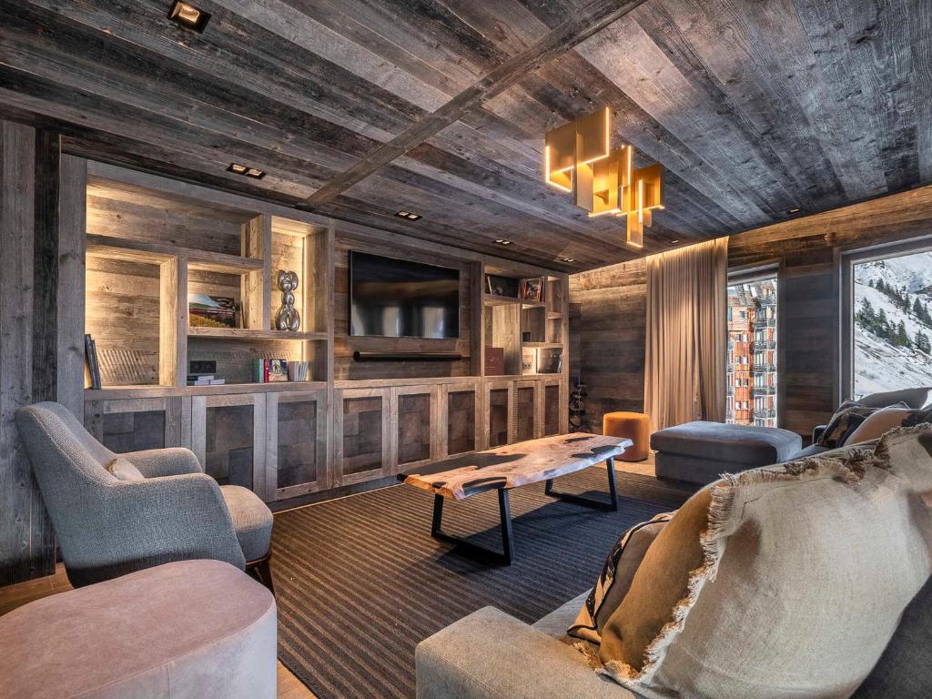 a living room with a couch and chairs and a table at Chalet Avoriaz, 6 pièces, 11 personnes - FR-1-314-104 in Avoriaz