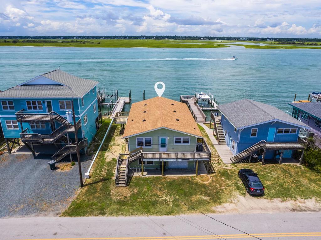 an aerial view of a house on the water at Seahorse Sound in Topsail Beach