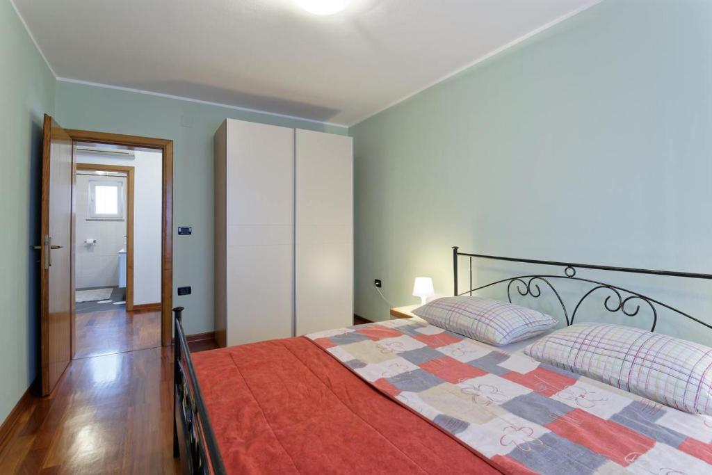 Łóżko lub łóżka w pokoju w obiekcie Apartment Maritea by Rent Istria