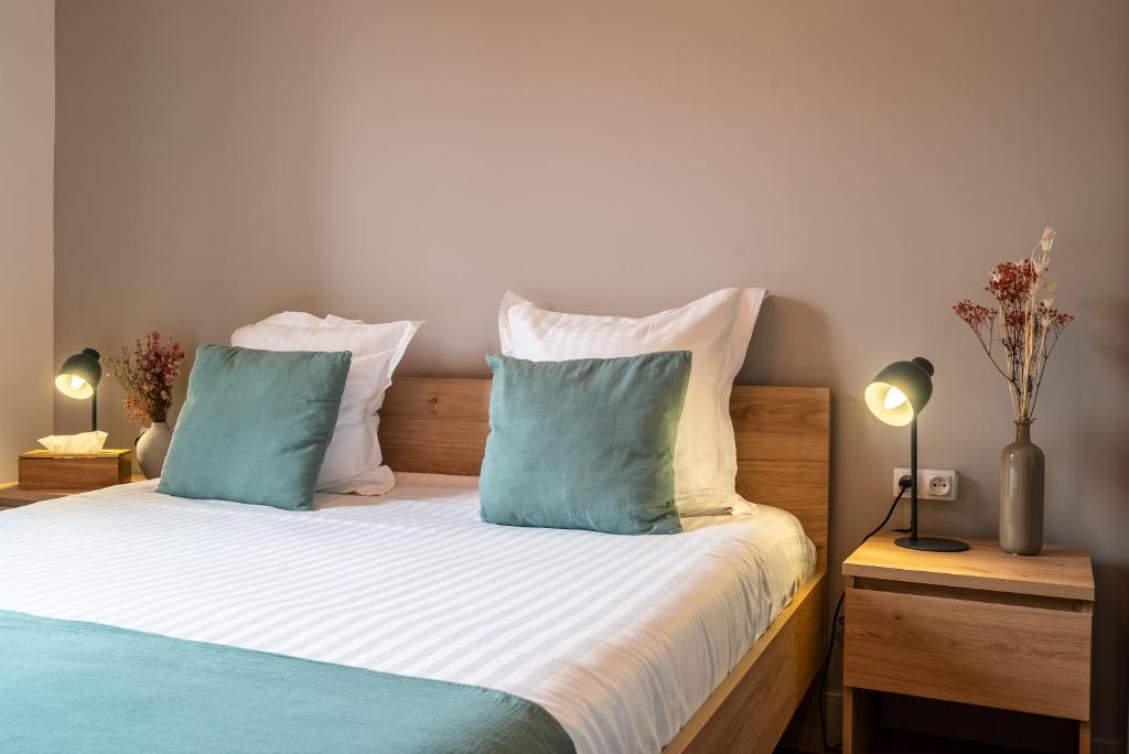 Posteľ alebo postele v izbe v ubytovaní Mon Appart'hôtel - Gare de Limoges - Appartement familial - Parking en supp