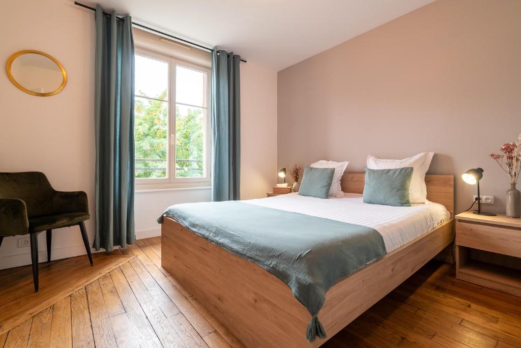 Posteľ alebo postele v izbe v ubytovaní Mon Appart'hôtel - Gare de Limoges - Appartement familial - Parking en supp
