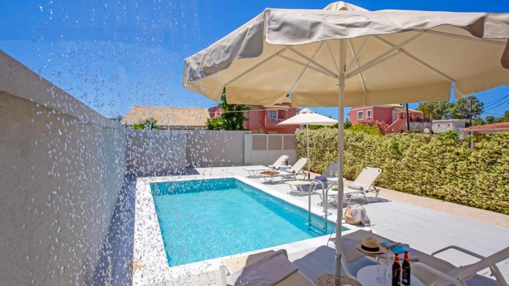 The swimming pool at or close to Cosmos Villas Spyridoula