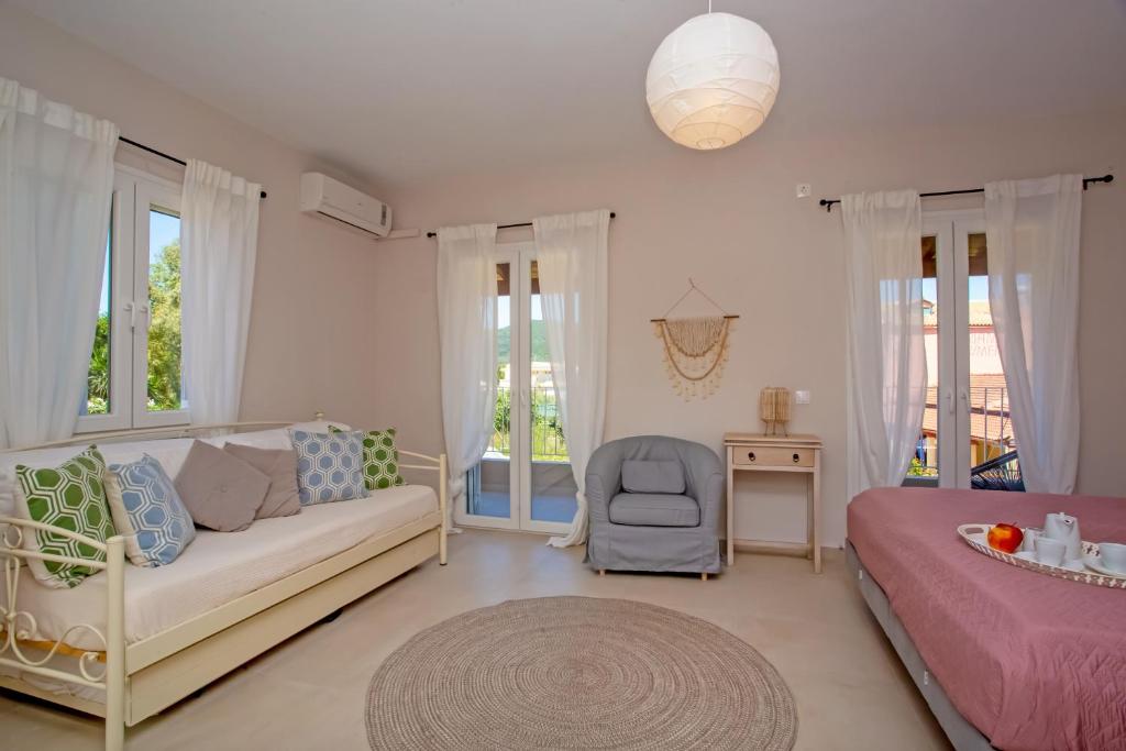 A bed or beds in a room at Cosmos Villas Spyridoula