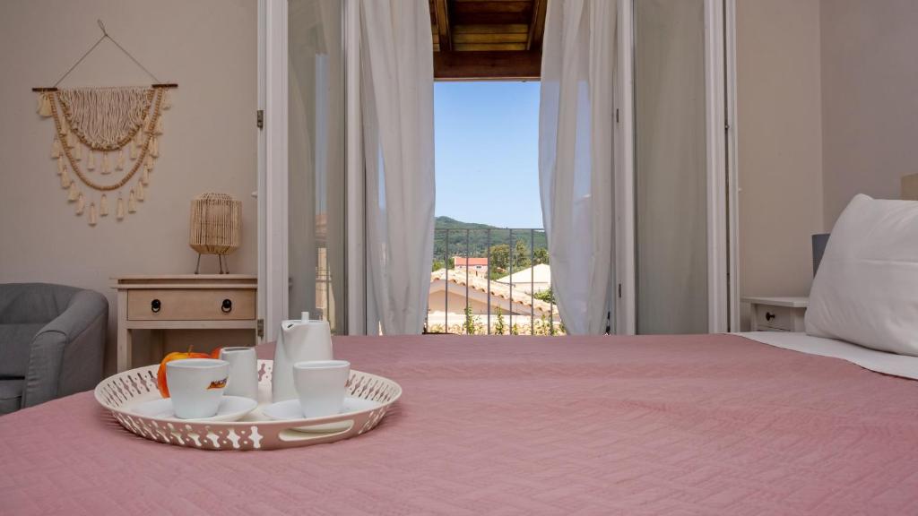 A bed or beds in a room at Cosmos Villas Spyridoula