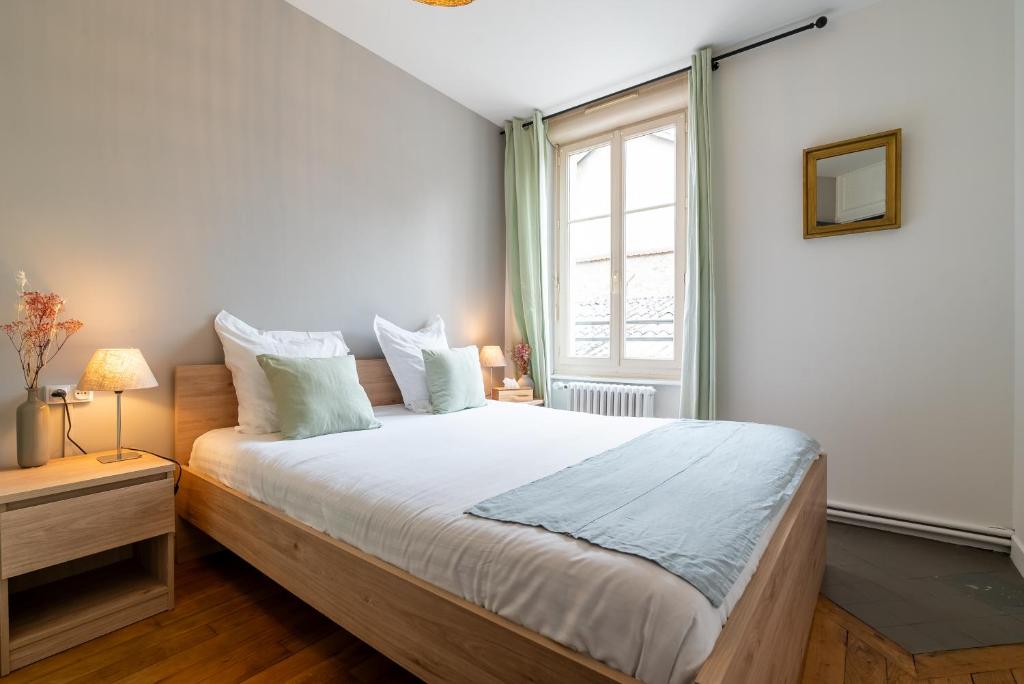 Posteľ alebo postele v izbe v ubytovaní Mon Appart'hôtel - Gare de Limoges - Appartement familial - Parking en supp