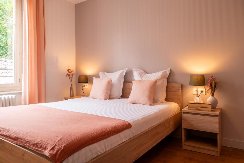 Posteľ alebo postele v izbe v ubytovaní Mon Appart'hôtel - Gare de Limoges - Appartement familial - Parking en supp