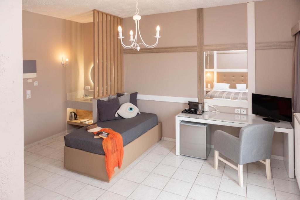 TV a/nebo společenská místnost v ubytování Lino Mare Boutique Hotel