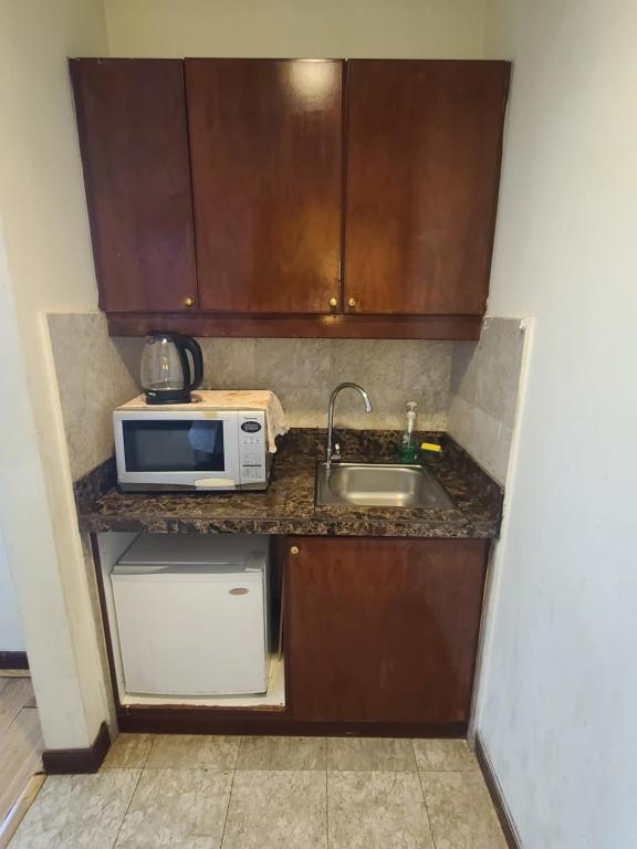 Kuchyň nebo kuchyňský kout v ubytování KL Time Square Hotal Sarvice Suite