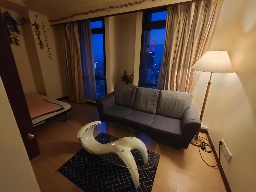 Posezení v ubytování KL Time Square Hotal Sarvice Suite