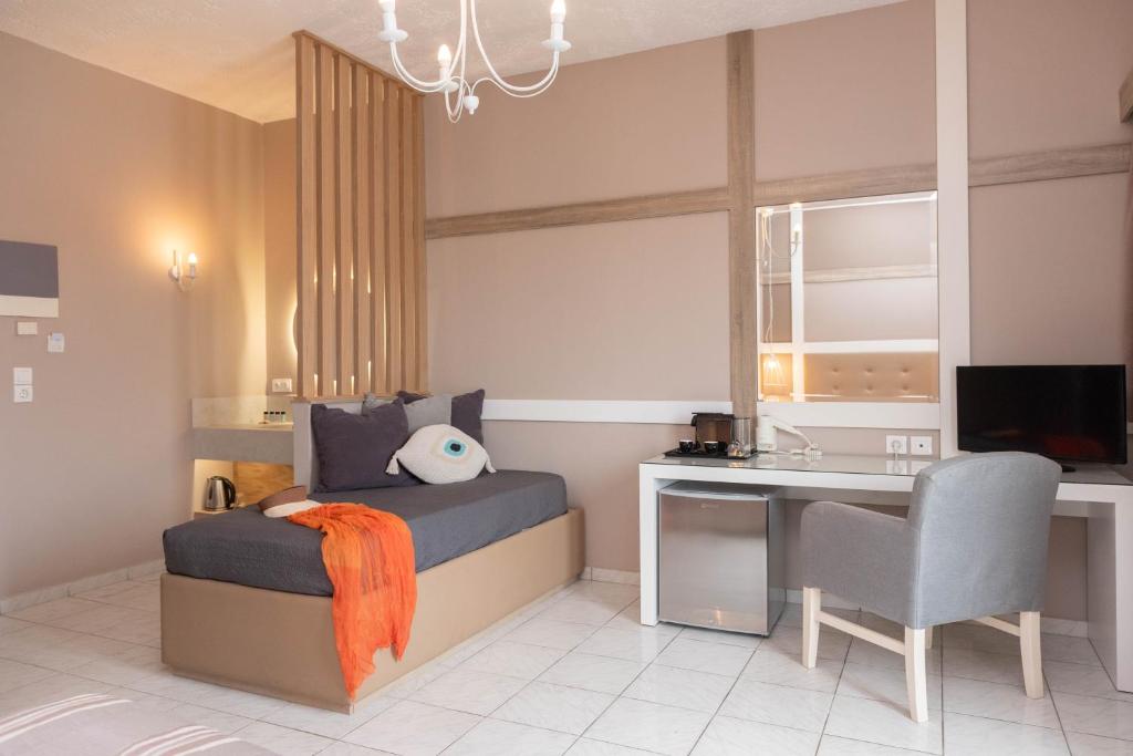 TV a/nebo společenská místnost v ubytování Lino Mare Boutique Hotel
