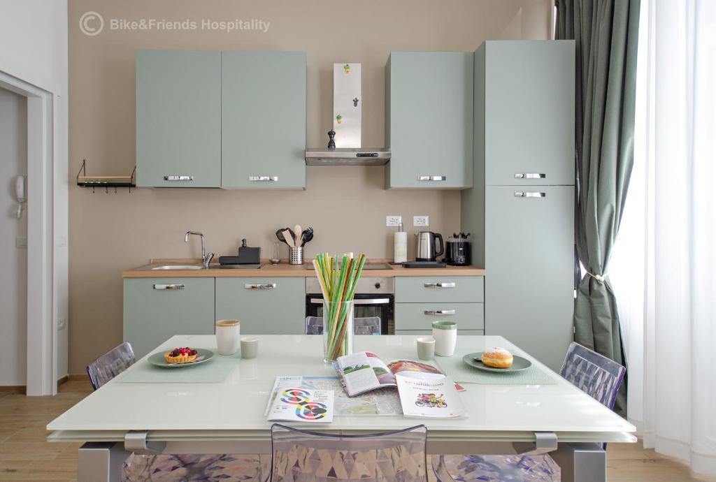 a kitchen with a table with two plates of food on it at CASA CAMILLA in Pesaro