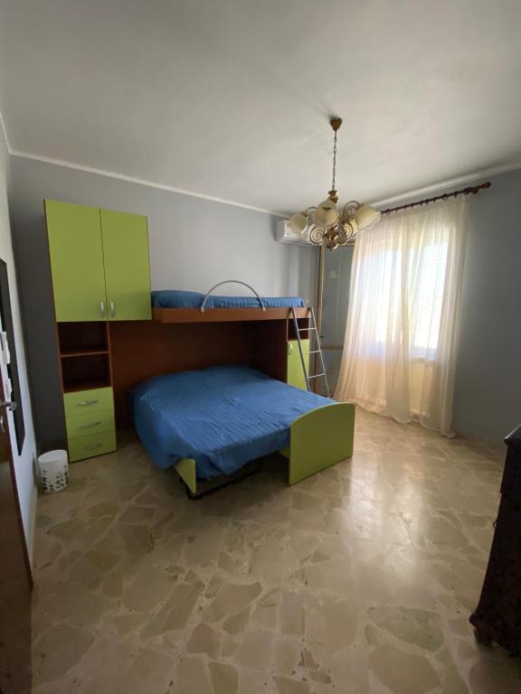 Ένα ή περισσότερα κρεβάτια σε δωμάτιο στο Trinacria