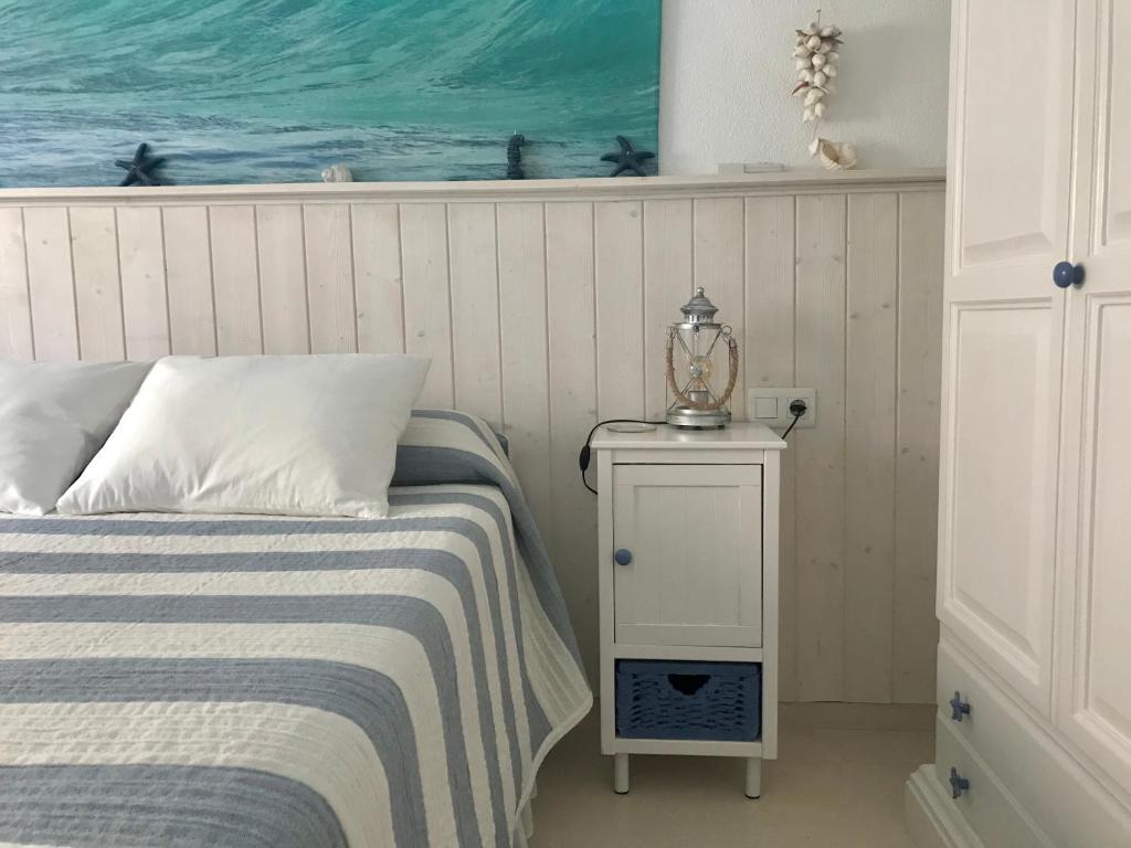 A bed or beds in a room at Apartamento DUPLEX CRUZ DEL MAR