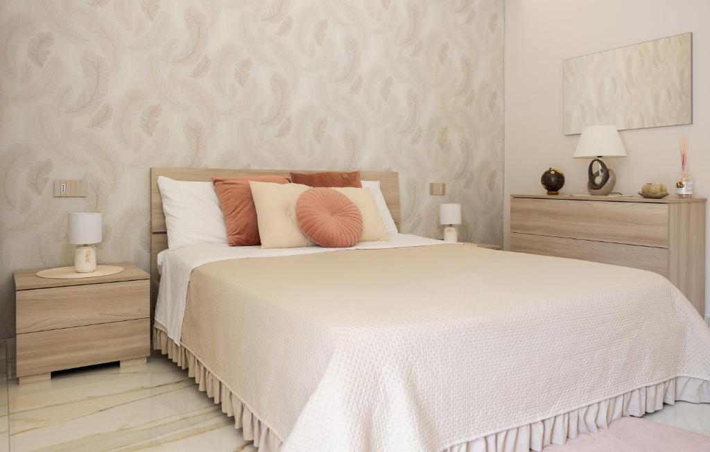 Postel nebo postele na pokoji v ubytování La Perla Luxury Rooms