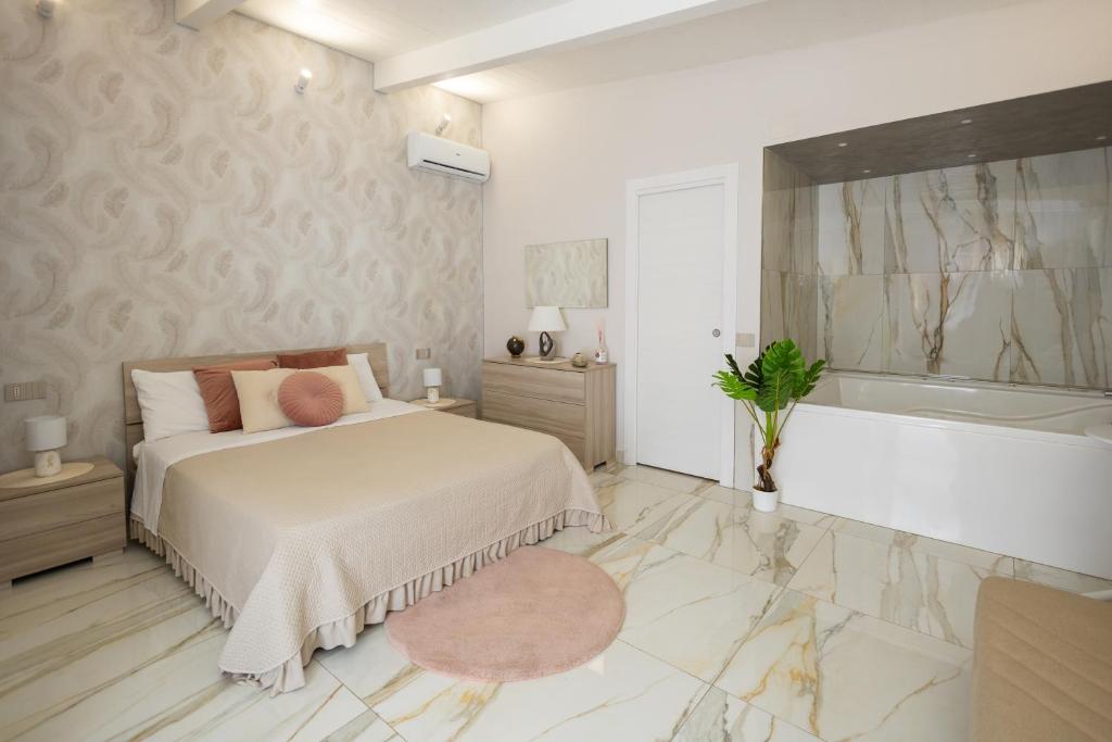 Postel nebo postele na pokoji v ubytování La Perla Luxury Rooms