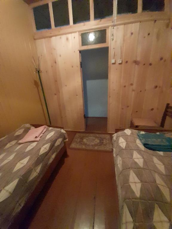Postel nebo postele na pokoji v ubytování Guest House Zhora Kaldani