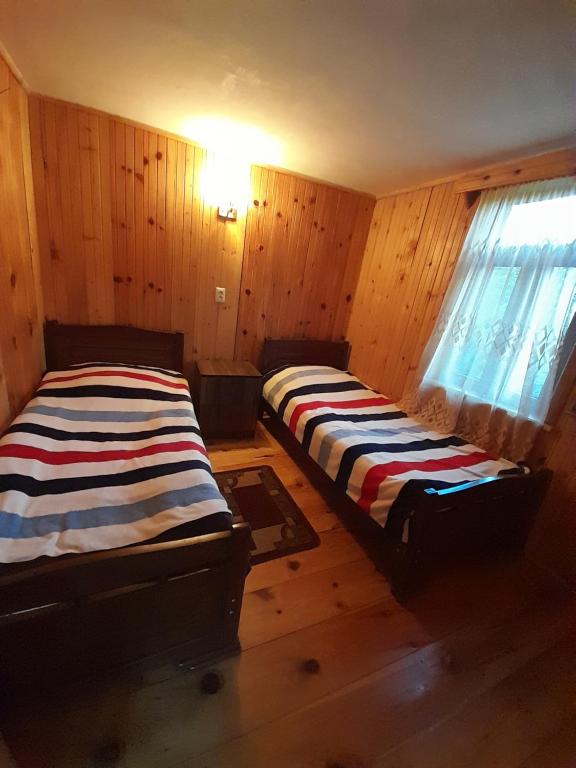 Postel nebo postele na pokoji v ubytování Guest House Zhora Kaldani