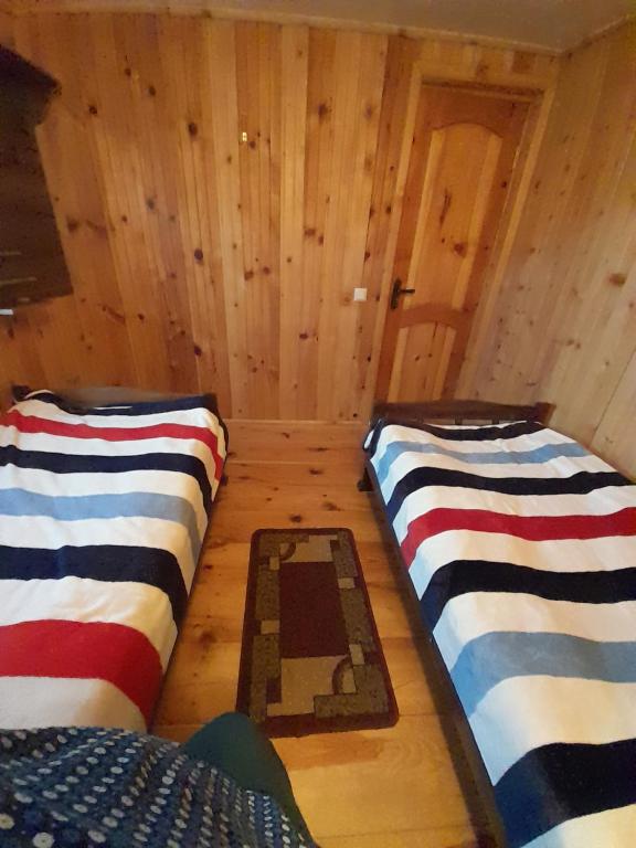 Postel nebo postele na pokoji v ubytování Guest House Zhora Kaldani
