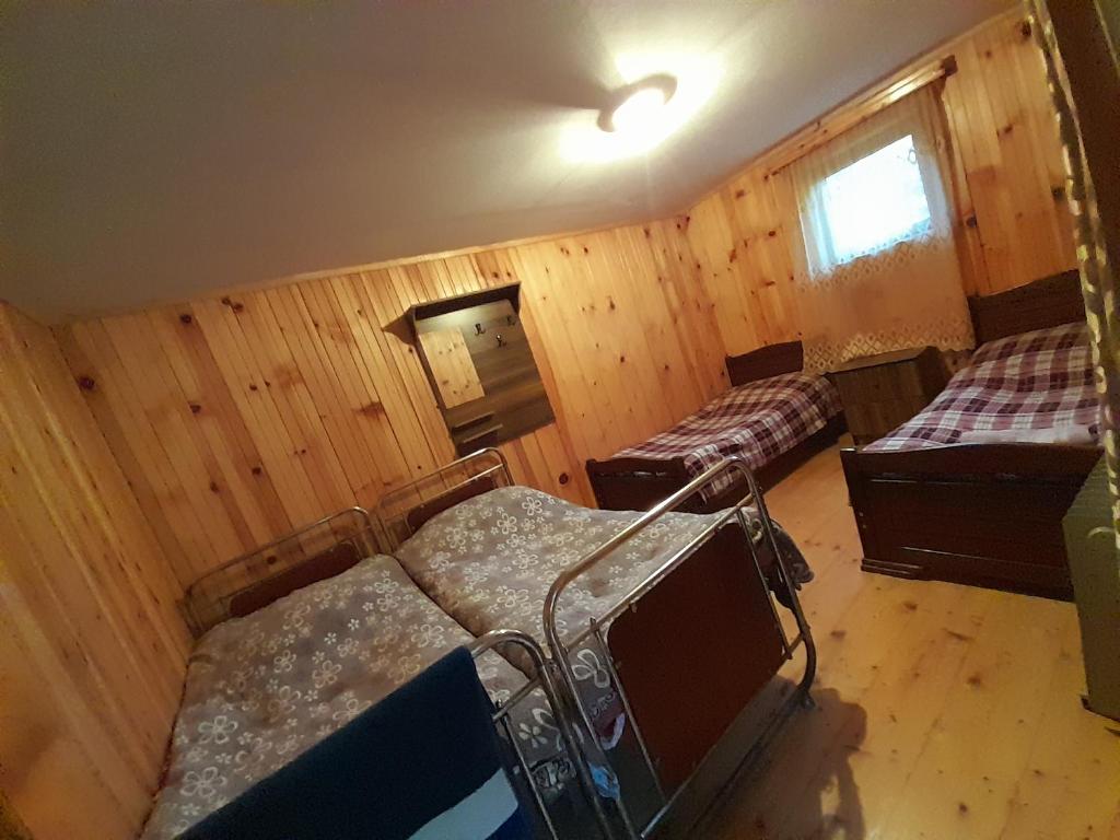 Postel nebo postele na pokoji v ubytování Guest House Zhora Kaldani