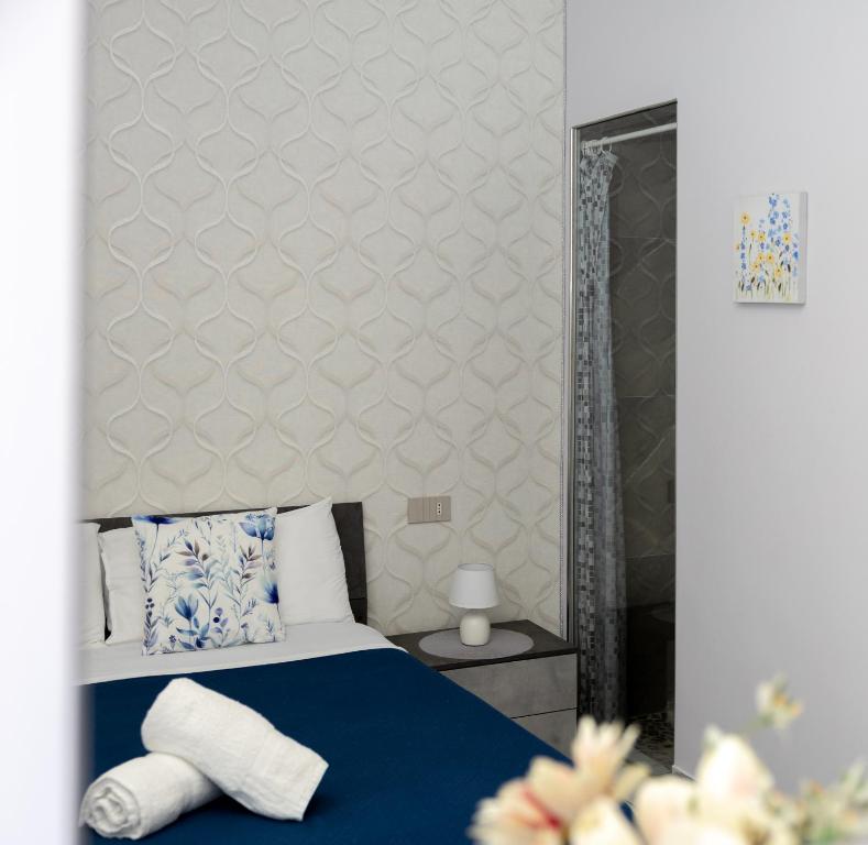 Postel nebo postele na pokoji v ubytování La Perla Luxury Rooms