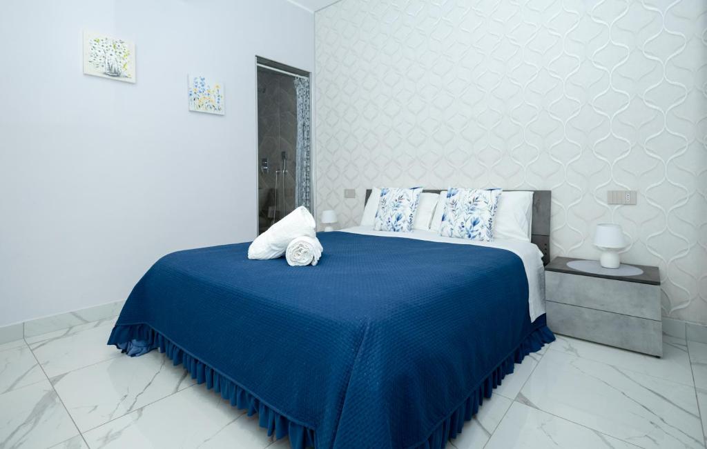 Postel nebo postele na pokoji v ubytování La Perla Luxury Rooms