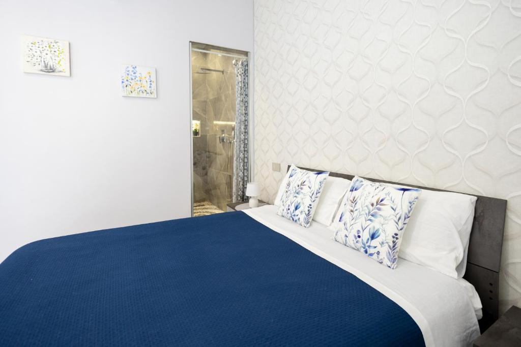 Postel nebo postele na pokoji v ubytování La Perla Luxury Rooms