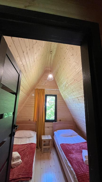 Postel nebo postele na pokoji v ubytování Garden House Mestia