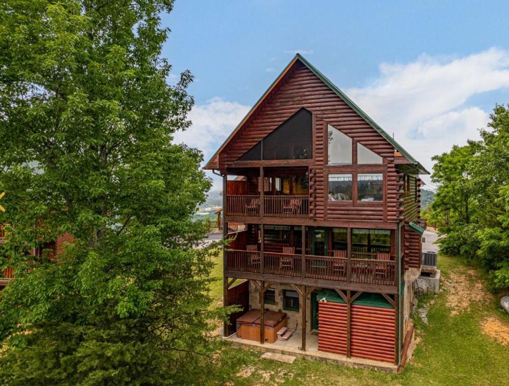 an overhead view of a house with a tree at Mountain Paradise by Eden Crest in Sevierville