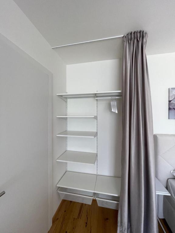 Postel nebo postele na pokoji v ubytování H52 Apartments