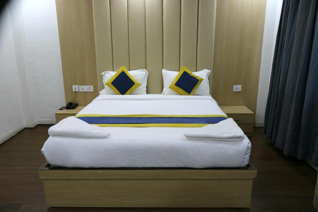 Postel nebo postele na pokoji v ubytování Hotel Mustang Holiday Inn