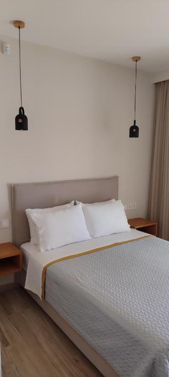 Posteľ alebo postele v izbe v ubytovaní Zephyros Villas - Agios Nikitas