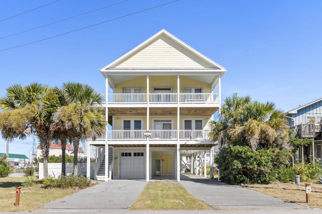 a house on the beach with palm trees at Windansea in Surf City