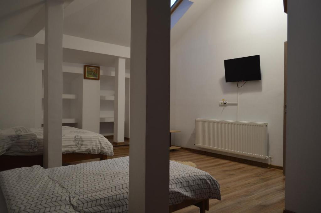 Postel nebo postele na pokoji v ubytování Pensiunea VisAventura