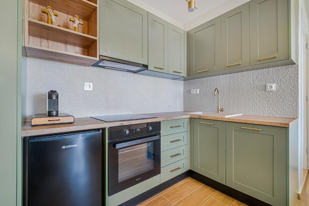 Kuchyň nebo kuchyňský kout v ubytování Merelia Aurora Apartments