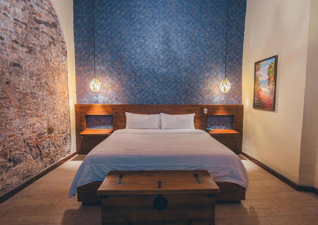 Postel nebo postele na pokoji v ubytování Hotel Boutique Casa Altamira